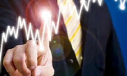 A businessperson making a thumb gesture with their hand. Exploring the science of body language in the workplace.